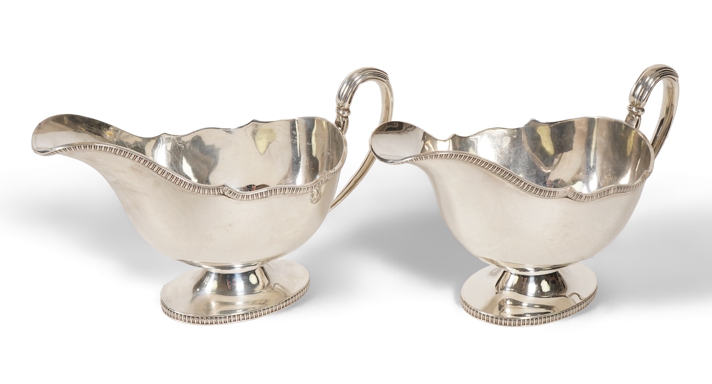 A pair of George V silver pedestal sauce boats, by Howson Brothers